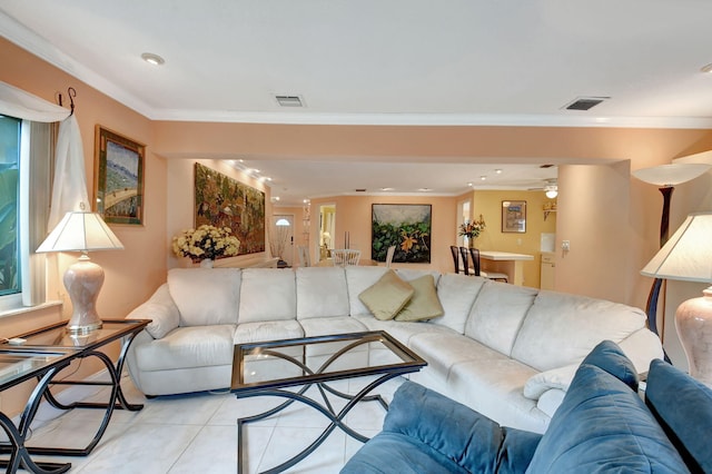 tiled living room with ornamental molding