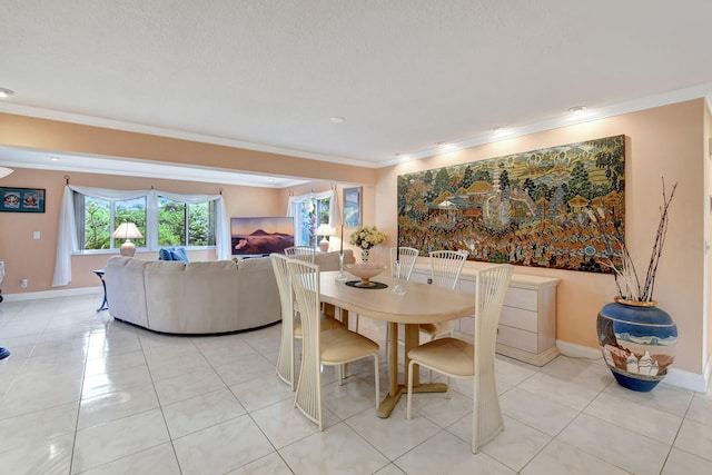 tiled dining room featuring crown molding