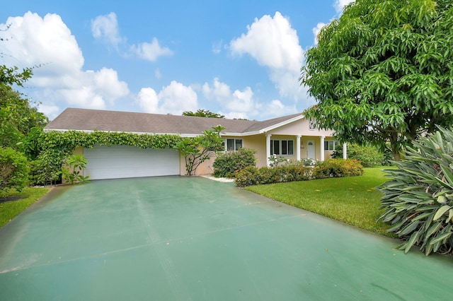 single story home featuring a garage and a front lawn