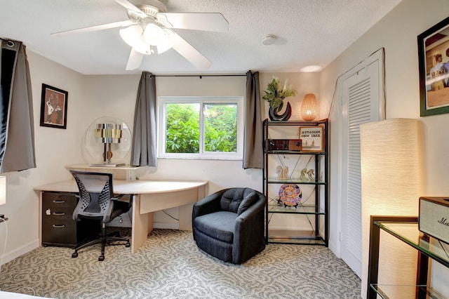 office space featuring ceiling fan and a textured ceiling