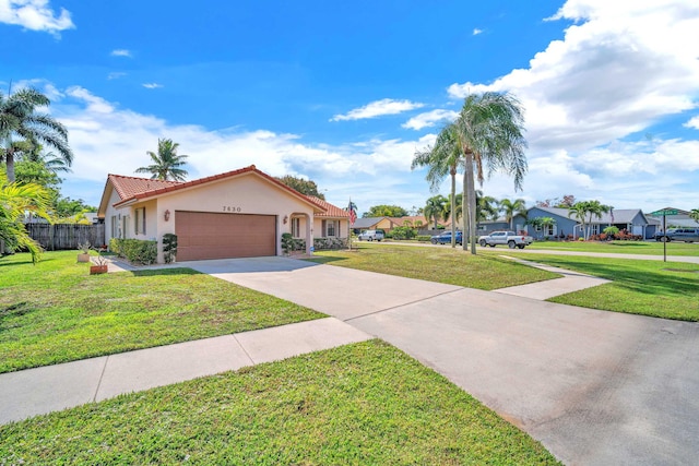 single story home with a front yard, driveway, an attached garage, stucco siding, and a tile roof