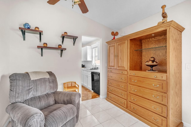 living area with ceiling fan and light tile patterned flooring