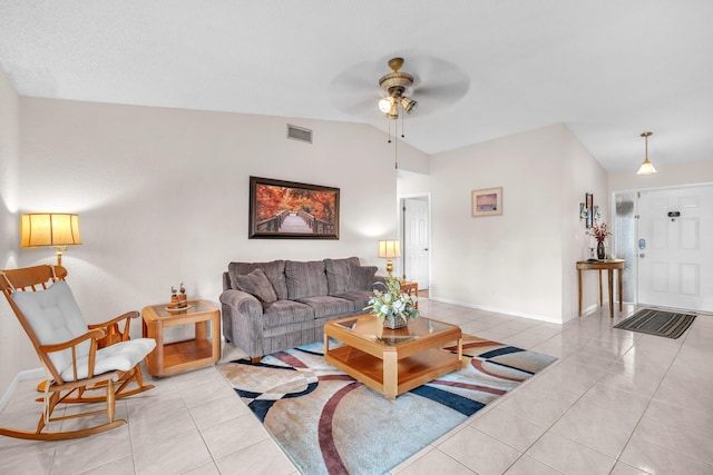 living area with light tile patterned floors, visible vents, ceiling fan, and lofted ceiling