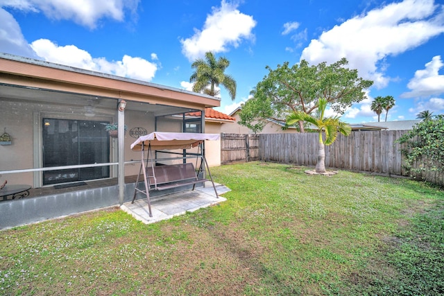 view of yard with a patio area and a fenced backyard