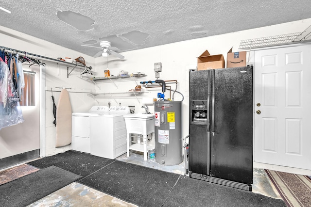 washroom featuring a ceiling fan, washer and dryer, a sink, a textured ceiling, and water heater