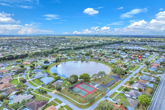 drone / aerial view featuring a residential view and a water view