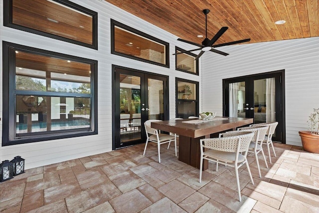 view of patio / terrace featuring a ceiling fan, outdoor dining space, and french doors