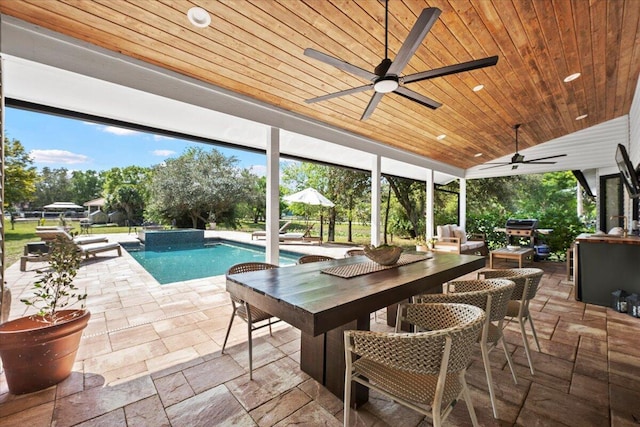 sunroom featuring plenty of natural light and wooden ceiling