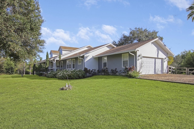 ranch-style home with a front lawn and an attached garage