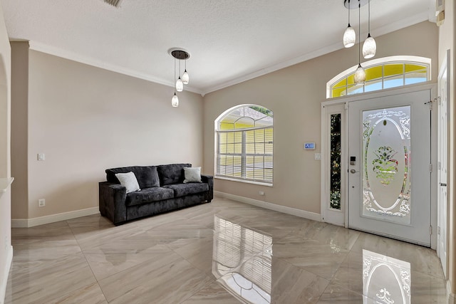 entryway with crown molding and a textured ceiling