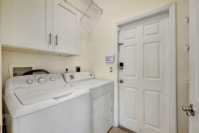 laundry area with cabinets and separate washer and dryer