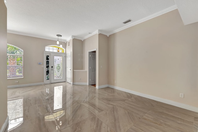 entryway featuring crown molding and a textured ceiling