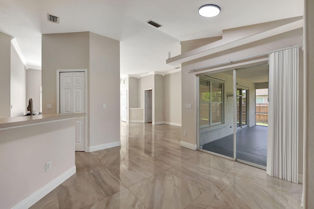 spare room featuring crown molding