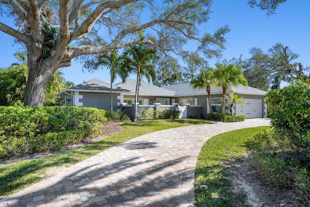 ranch-style home featuring a garage