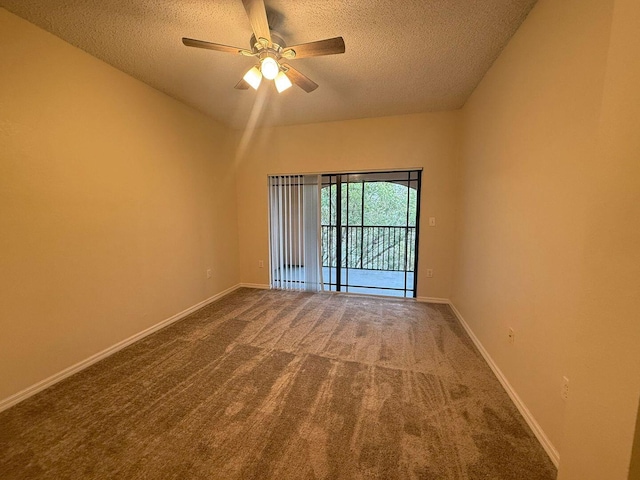 carpeted empty room featuring ceiling fan and a textured ceiling