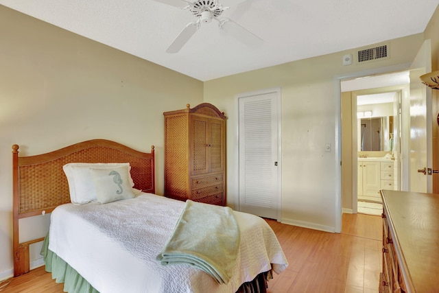 bedroom with a closet, ceiling fan, and light hardwood / wood-style flooring