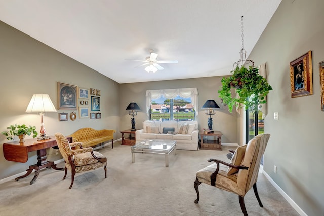 living room featuring ceiling fan, light colored carpet, and lofted ceiling