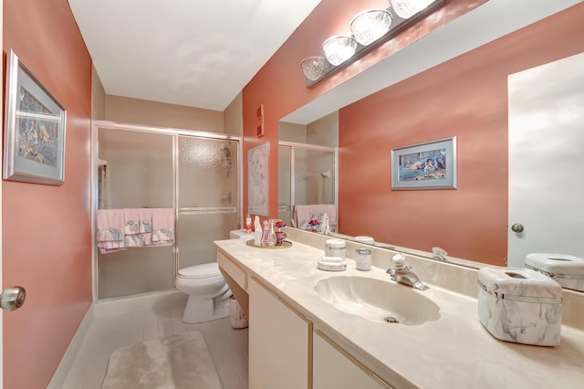 bathroom featuring vanity, an enclosed shower, tile patterned floors, and toilet