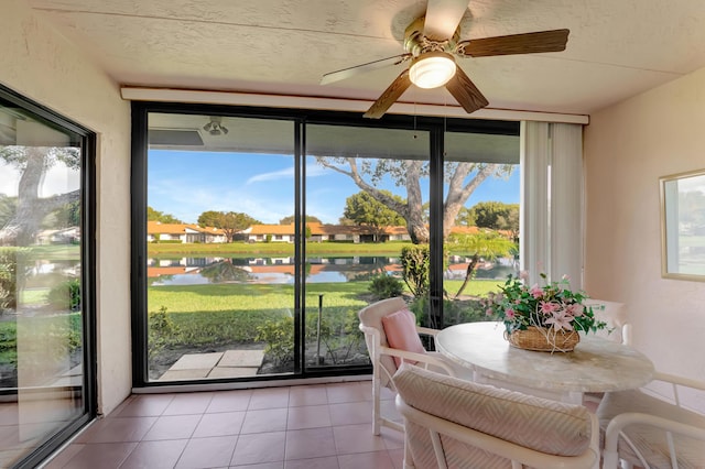 sunroom / solarium with a water view