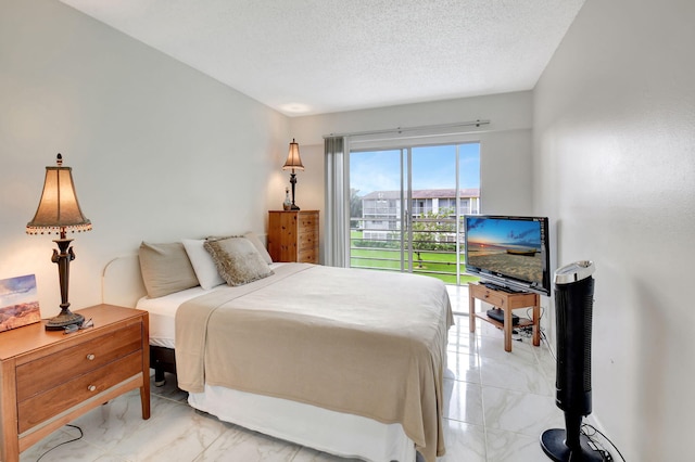 bedroom featuring a textured ceiling