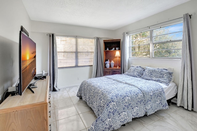 bedroom featuring a textured ceiling