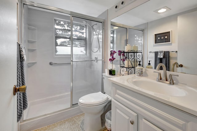 bathroom with vanity, an enclosed shower, and toilet