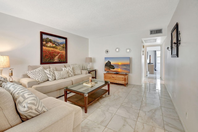 living room with a textured ceiling