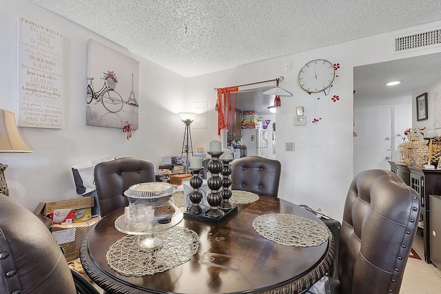 dining room with a textured ceiling