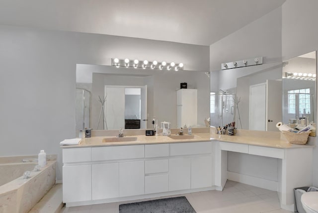 bathroom featuring vanity and separate shower and tub