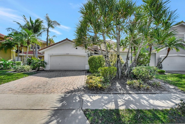 view of front of property with a garage