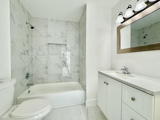 full bathroom with vanity, toilet, and tiled shower / bath