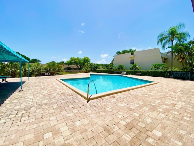 view of swimming pool featuring a patio