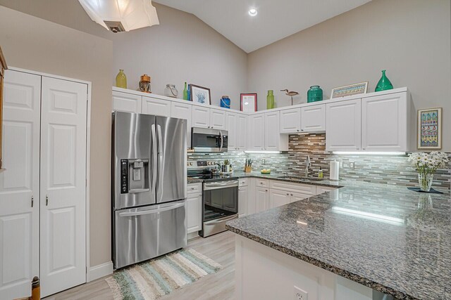 laundry room featuring a textured ceiling, laundry area, and washer and clothes dryer