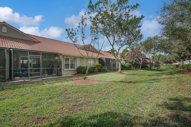 view of yard featuring a sunroom