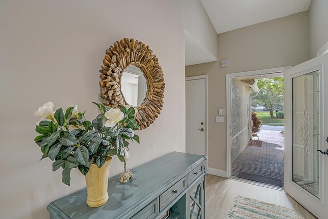 property entrance with a tiled roof and stucco siding