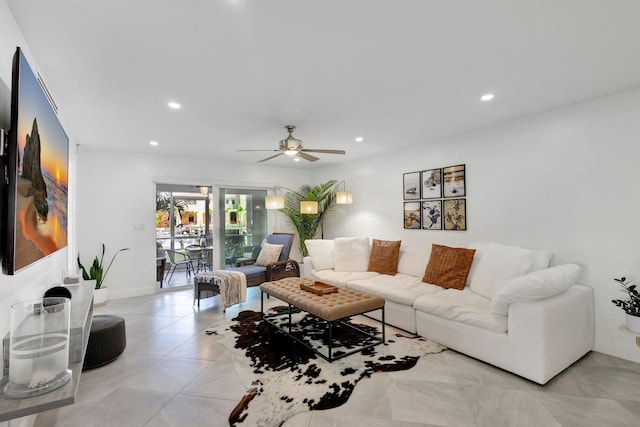 tiled living room featuring ceiling fan