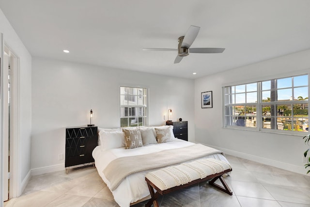 tiled bedroom featuring ceiling fan