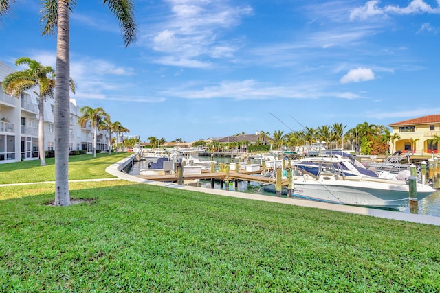 view of dock featuring a yard and a water view