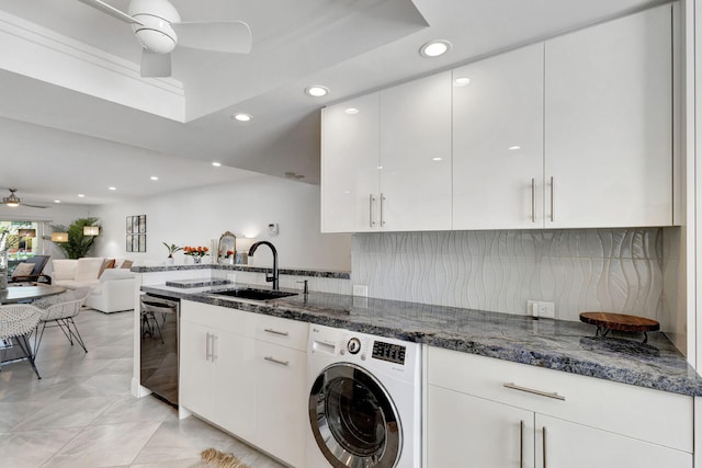 kitchen with white cabinetry, washer / clothes dryer, and dishwasher