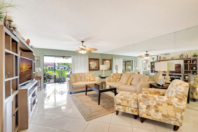 living room featuring a ceiling fan and light tile patterned flooring