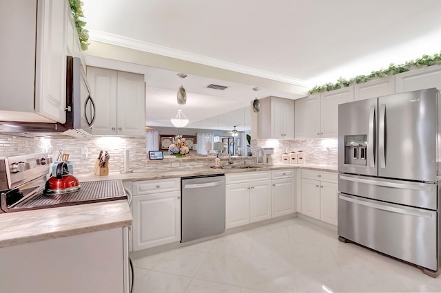 kitchen featuring white cabinets, a sink, stainless steel appliances, backsplash, and visible vents