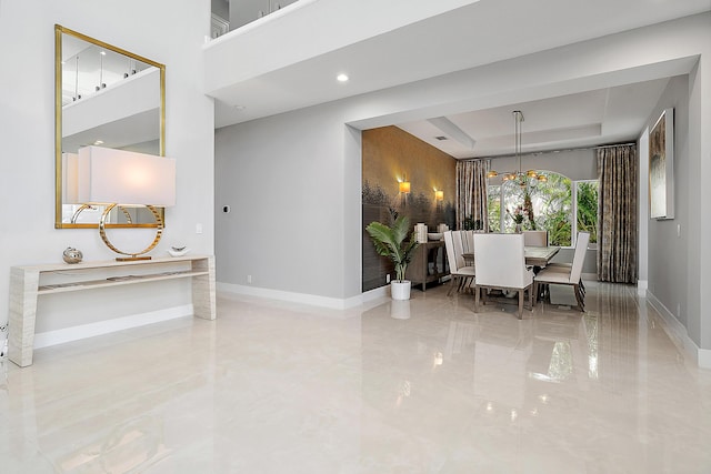 dining space with a tray ceiling