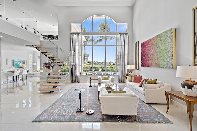 living room featuring a high ceiling