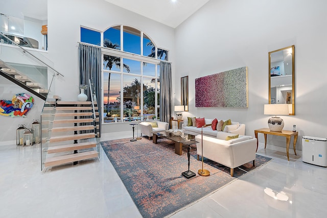 living room featuring a high ceiling