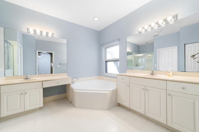 bathroom featuring vanity, tile patterned flooring, and separate shower and tub