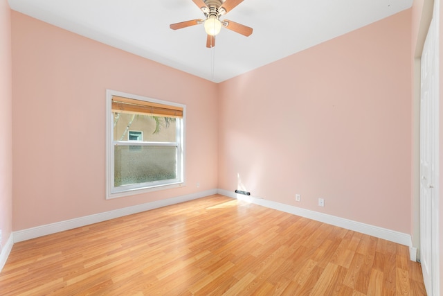 spare room with light hardwood / wood-style flooring and ceiling fan