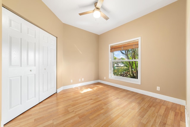 unfurnished bedroom with a closet, ceiling fan, and light hardwood / wood-style flooring