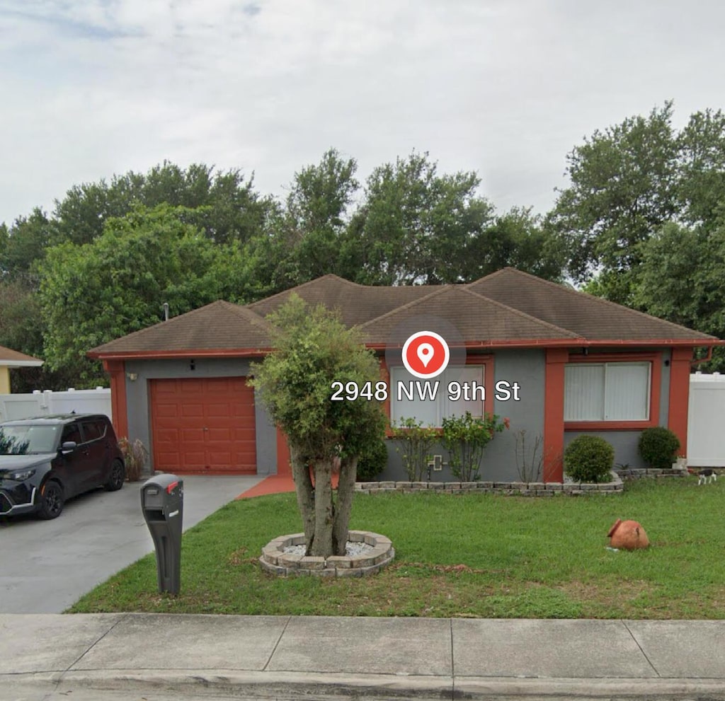 ranch-style house with a front yard