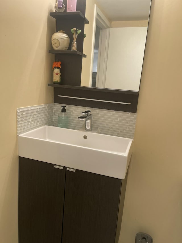 bathroom with vanity and backsplash