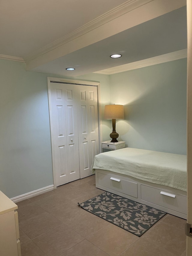 bedroom featuring ornamental molding and a closet